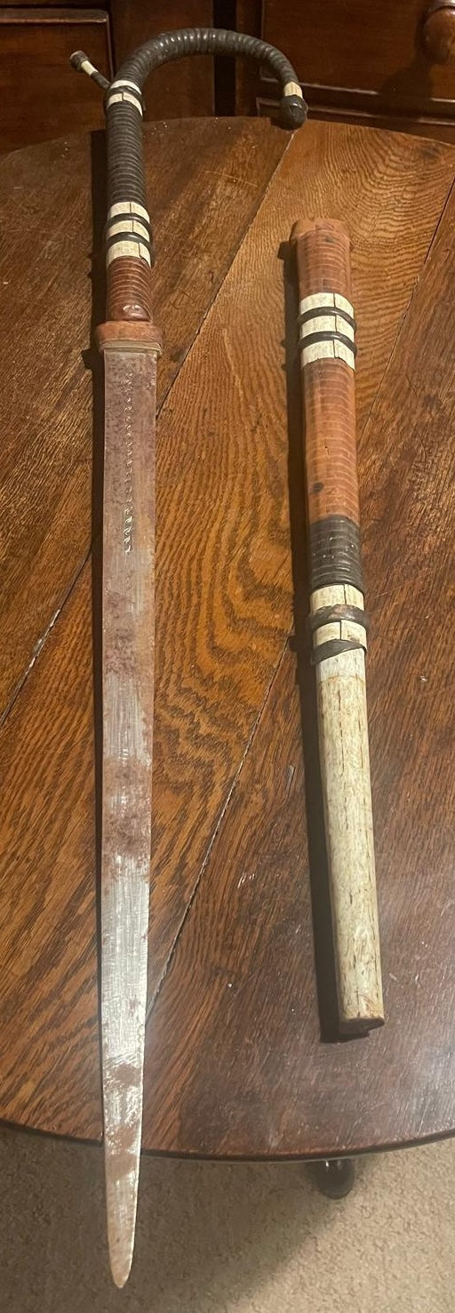 A rare and authentic African disguised sword cane, dated to c. 1920–40,