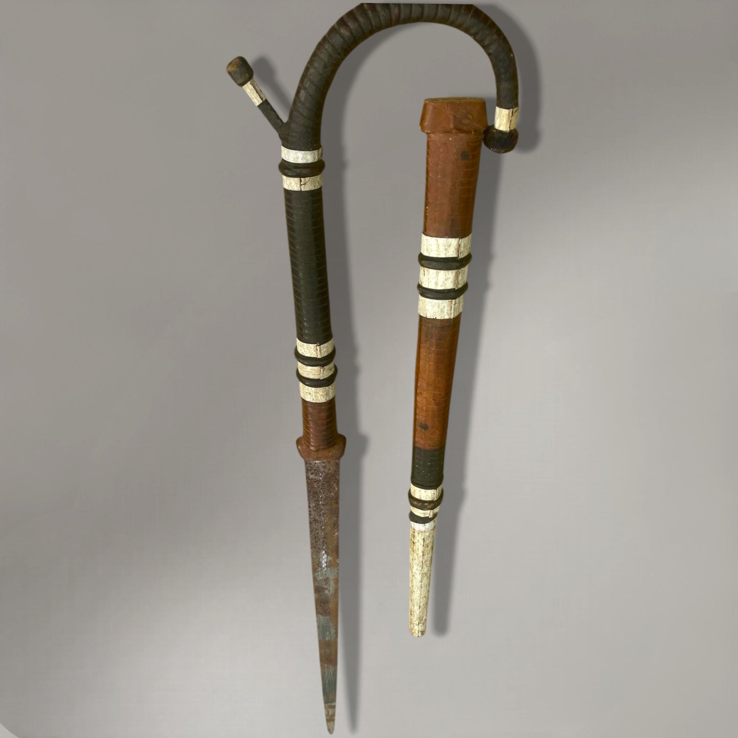 A rare and authentic African disguised sword cane, dated to c. 1920–40,