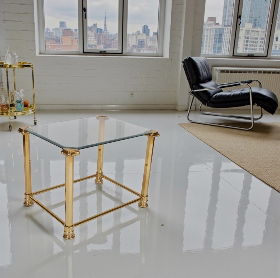 A nest of  three 1970s Maison Jansen style brass and glass tables.