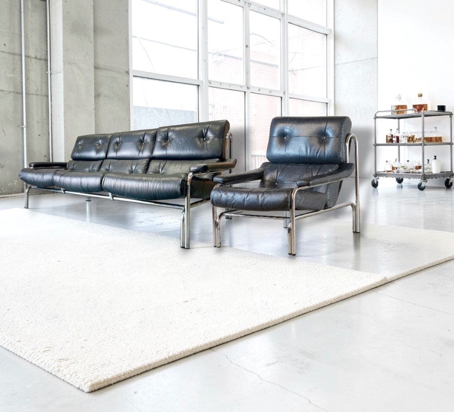 1970s Pieff Alpha lounge suite in original black leather with polished chrome frames, attributed to Tim Bates.