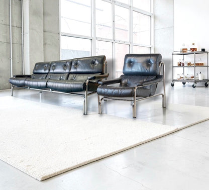 1970s Pieff Alpha lounge suite in original black leather with polished chrome frames, attributed to Tim Bates.