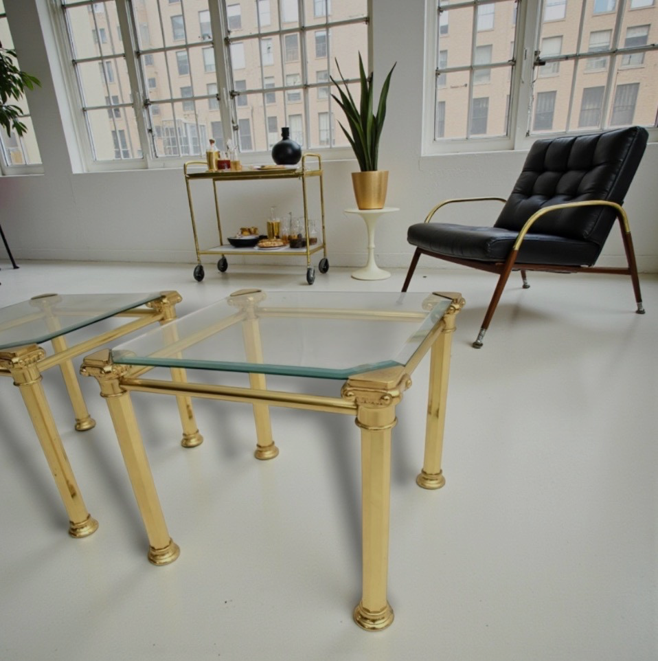A nest of  three 1970s Maison Jansen style brass and glass tables.