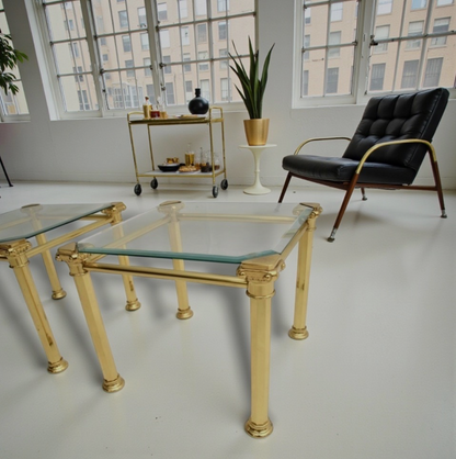 A nest of  three 1970s Maison Jansen style brass and glass tables.